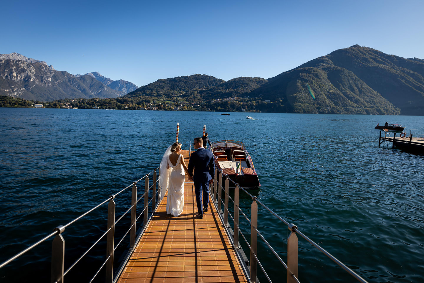 bride groom on dock of lake como