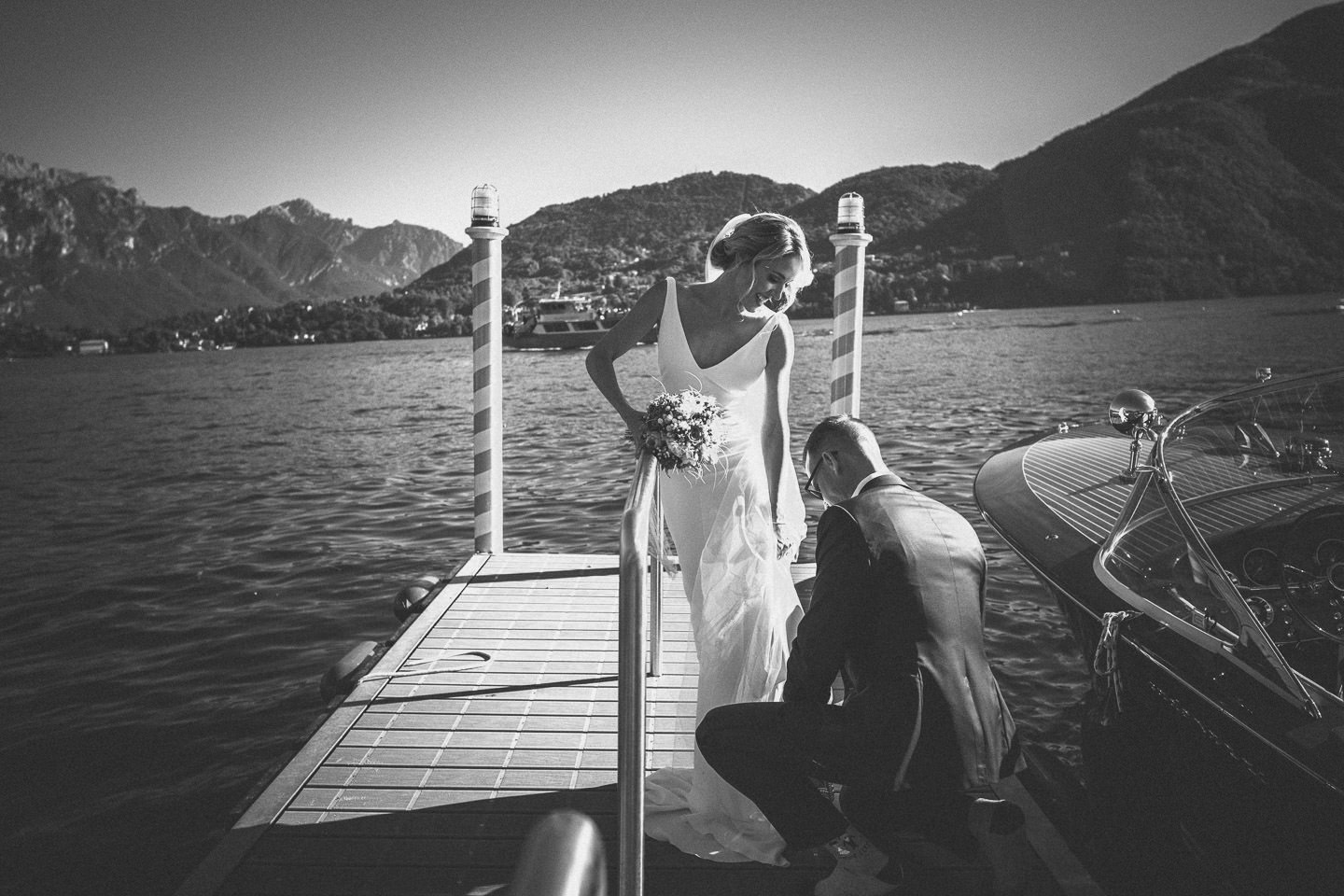 bride groom on dock of lake como