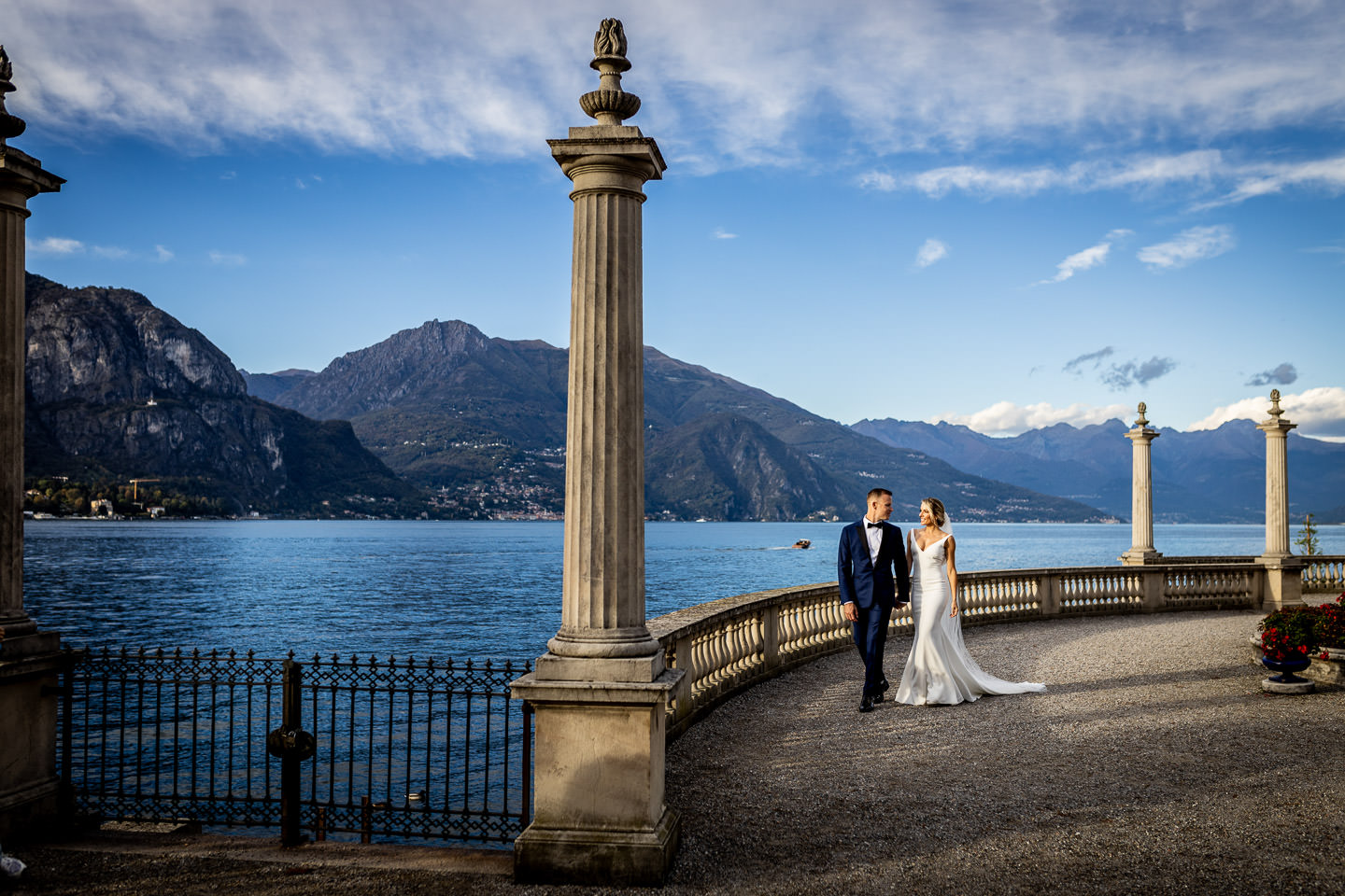 bride and groom walking in front of villa melzi bellagio como