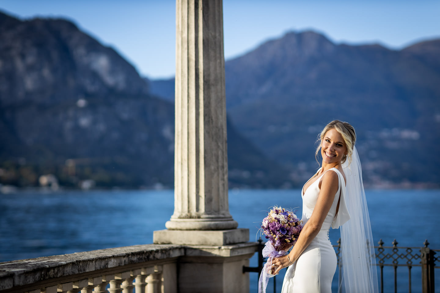 bride looking at the camera lake como in background