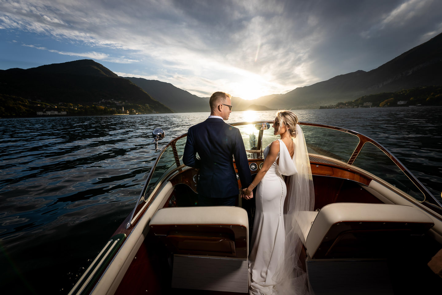 groom holding boat wheel